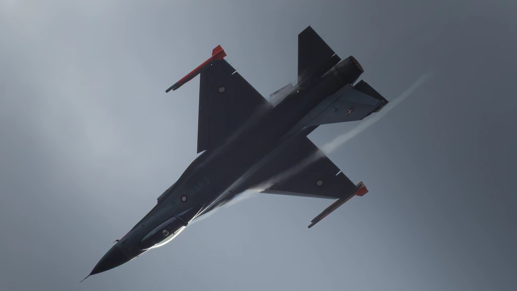 High-altitude pull-back over a mountain ridge at first light